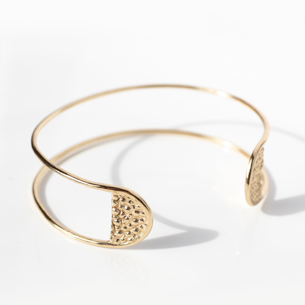 Stingray tab cuff bracelet in gold by jewelry designer Lauren Newton