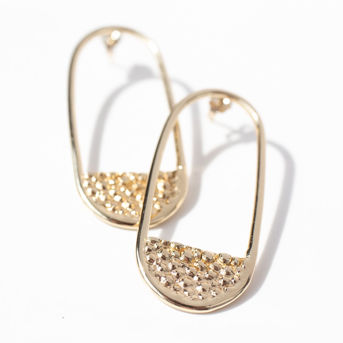 Stingray earrings in gold by jewelry designer Lauren Newton