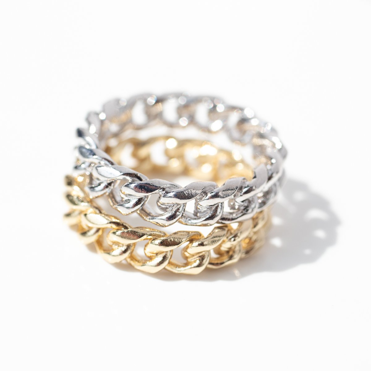 Gold chain ring and silver chain ring by jewelry designer Lauren Newton