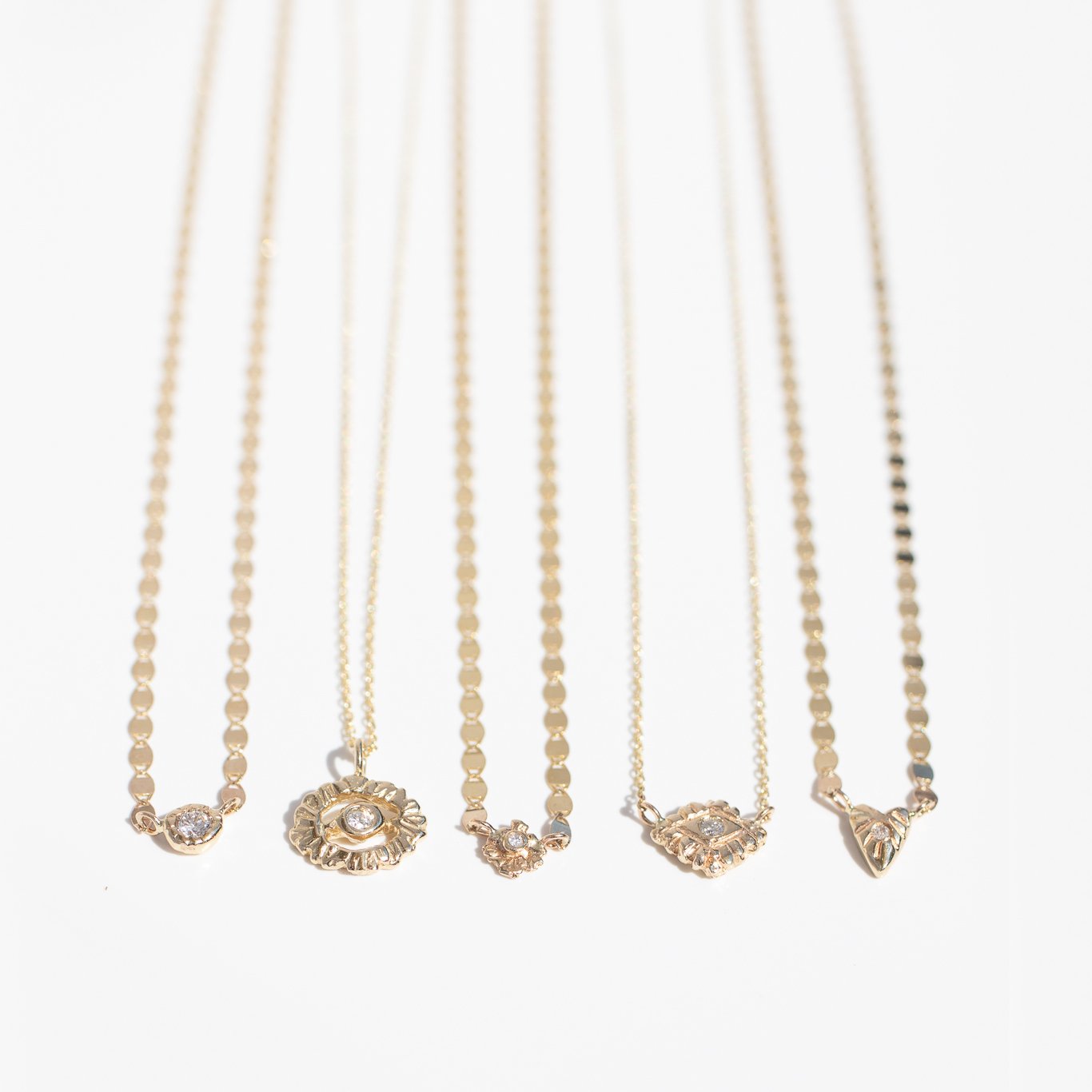 Gold diamond necklaces by jewelry designer Communion by Joy