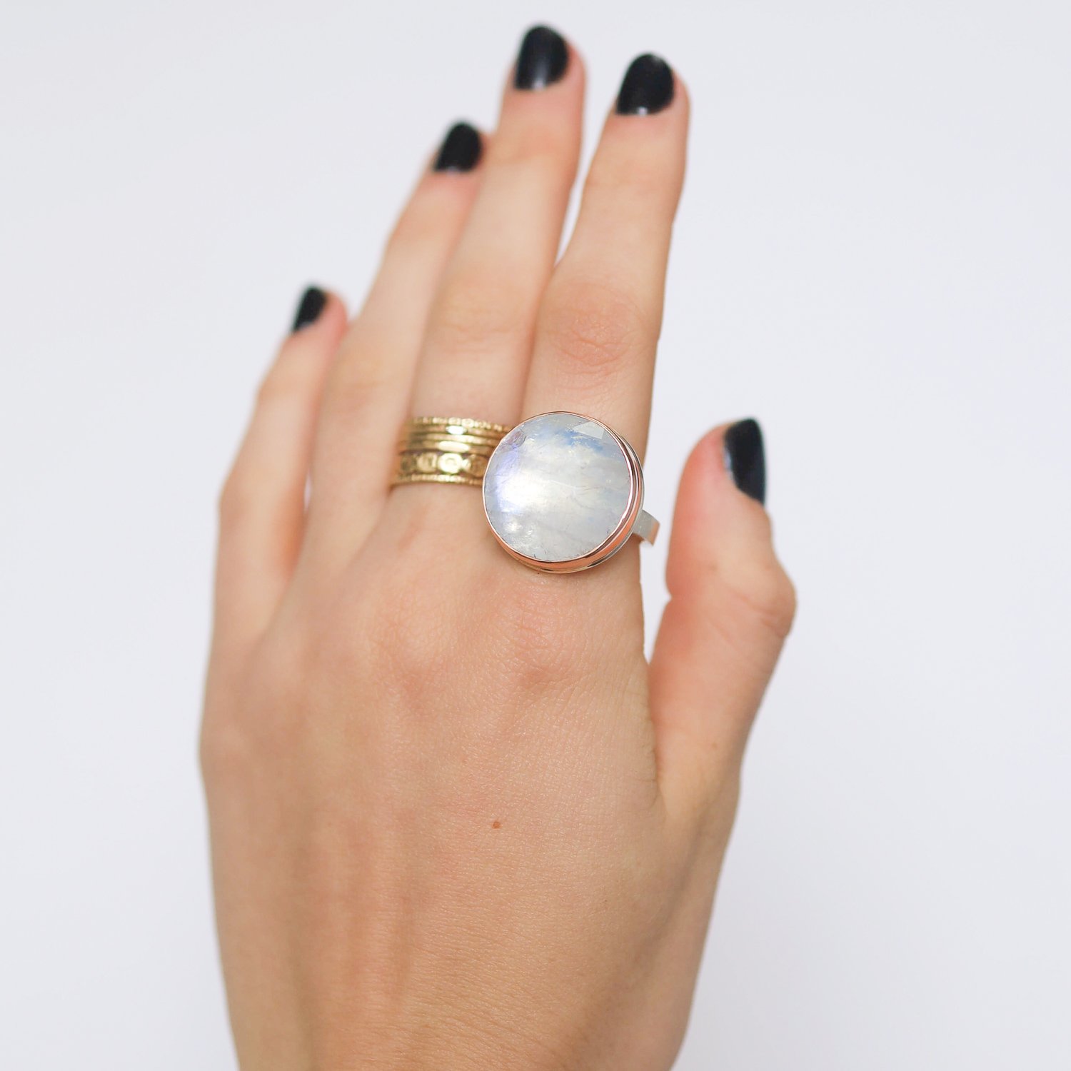 Jamie Joseph: Ring, Round rose cut, 14K rose gold bezel set white rainbow moonstone, Sterling silver X band, Stone measures 3/4 in diameter, Currently available in size 7 3/4