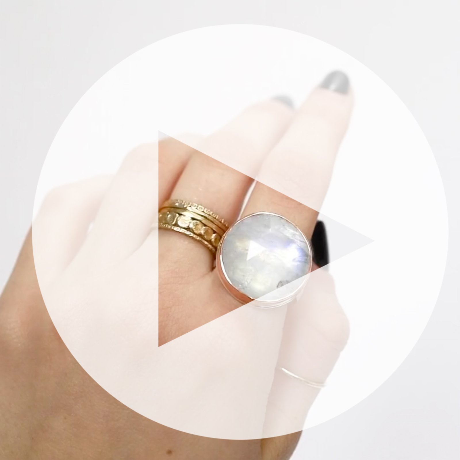 Jamie Joseph: Ring, Round rose cut, 14K rose gold bezel set white rainbow moonstone, Sterling silver X band, Stone measures 3/4 in diameter, Currently available in size 7 3/4