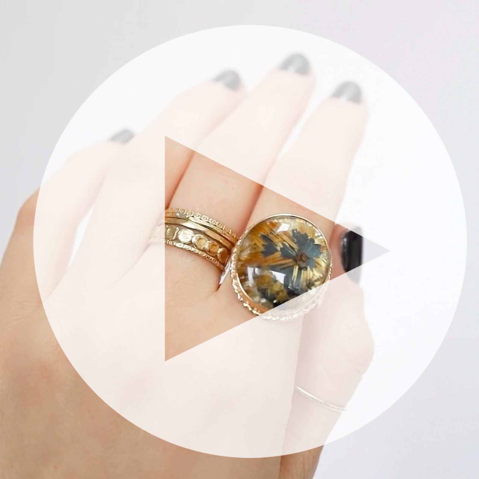 Jamie Joseph: Ring, Vertical oval smooth, 14K gold bezel set rutilated quartz on ruffled platform, 14K yellow gold dent band, Stone measures / x /, Currently available in size