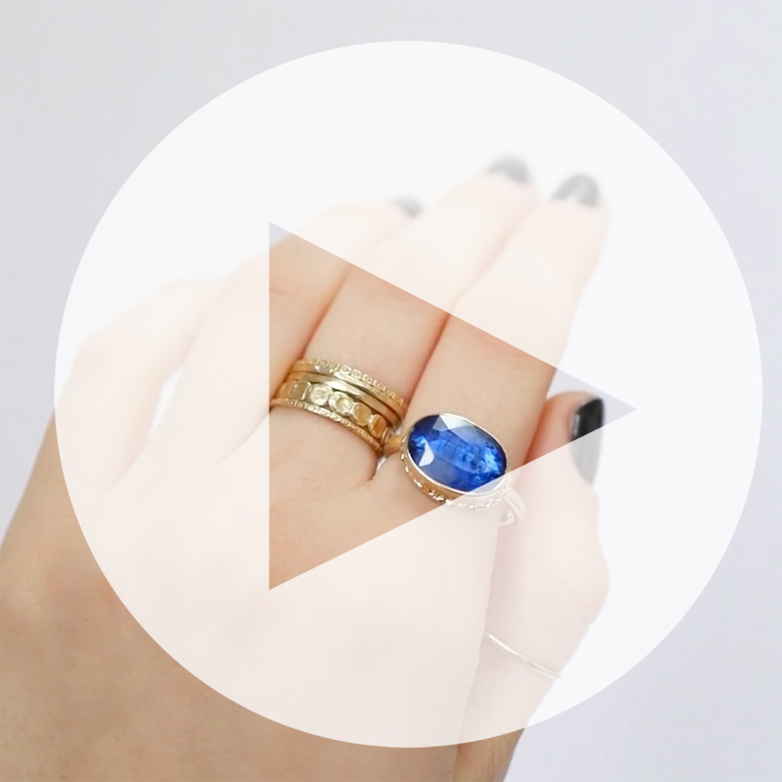 Jamie Joseph: Ring, Oval table up, 14K yellow gold bezel set kyanite on ruffled platform, 14K gold sand band, Stone measures 3/8 x 1/2, Currently available in size 6 3/4