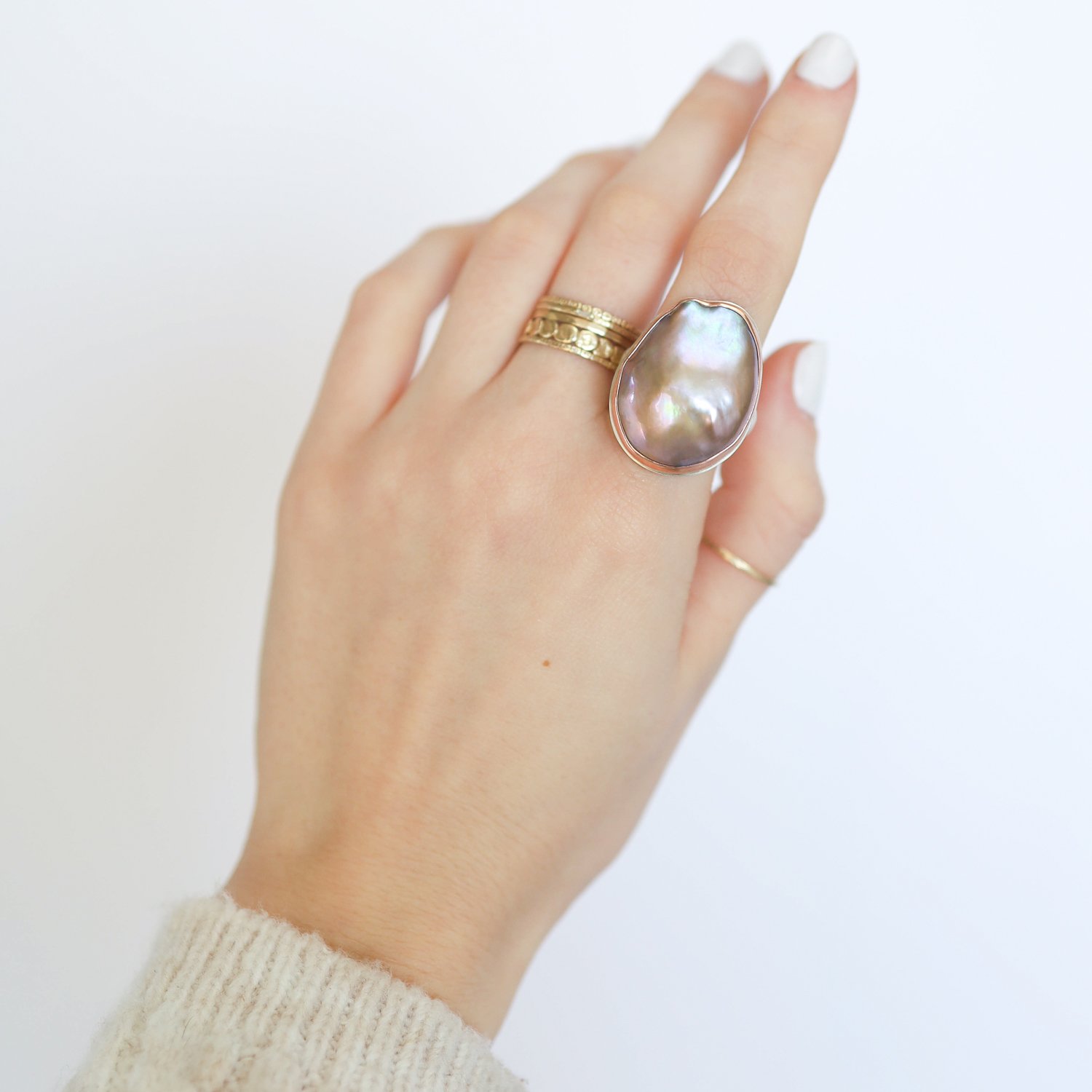 Jamie Joseph: Ring, Sterling silver & 14k Rose Gold with Large vertical asymmetrical Cultured Pearl,Groovy band,Stone measures 1 x3/4 ,Size 7.5