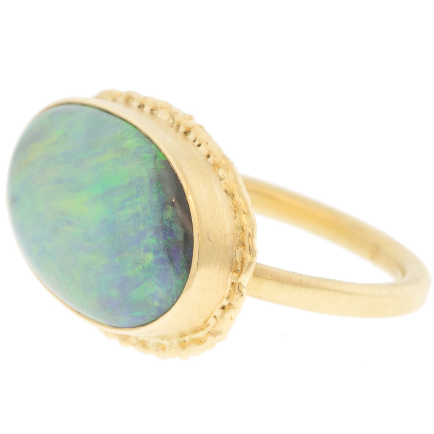 Jamie Joseph: Ring, Oval, 14K gold bezel set Australian black opal on ruffled platform, 14K gold sand band, Stone measures 7/16 x 3/4, Currently available in size 7