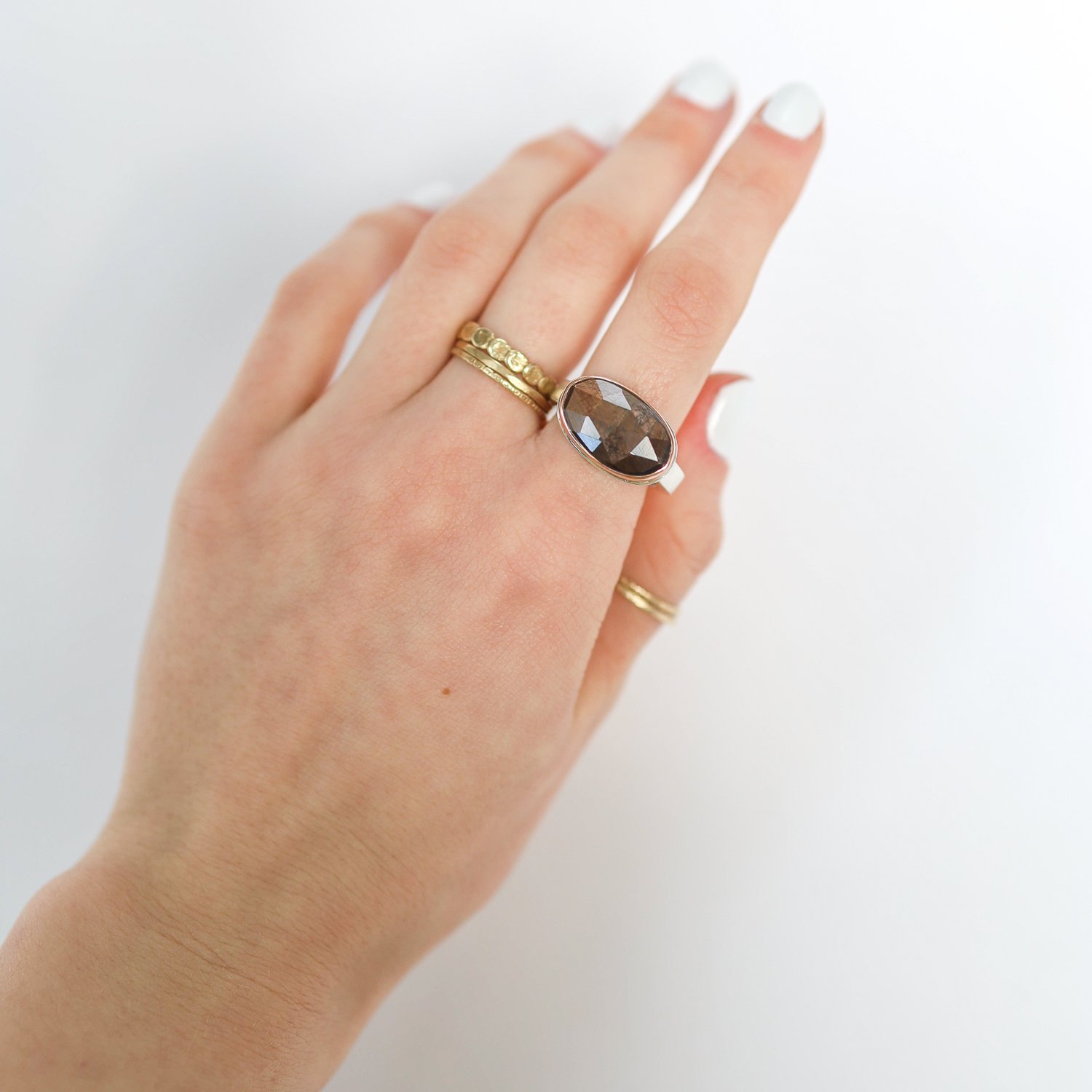 Jamie Joseph: Ring, Small oval rose cut, 14K rose gold bezel set brown sapphire, Sterling silver skinny smooth band, Stone measures 7/16 x 11/16, Currently available in size 7
