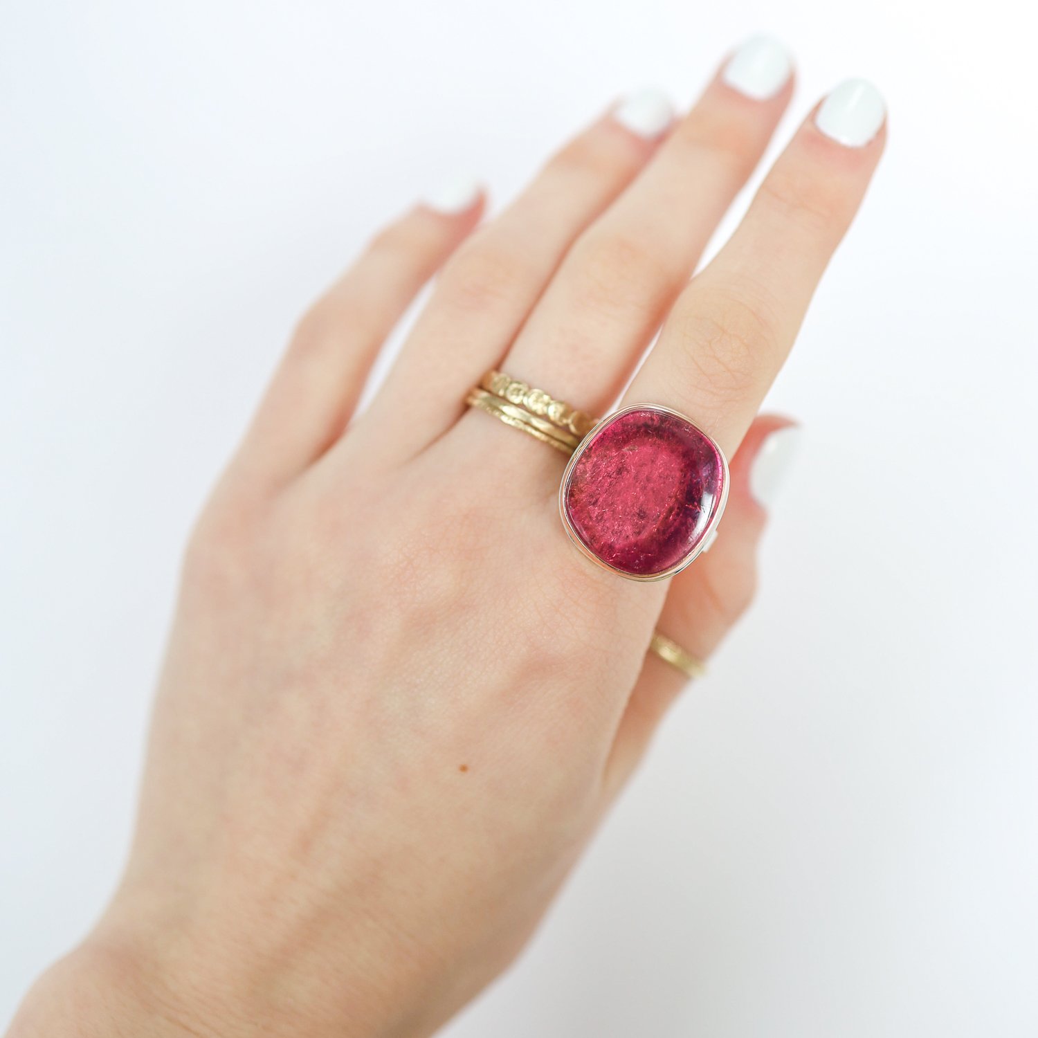 Jamie Joseph: Ring, Vertical asymmetrical smooth, 14K rose gold bezel set pink tourmaline, Sterling silver X band, Stone measures 7/8 x 3/4, Currently available in size 7 1/4