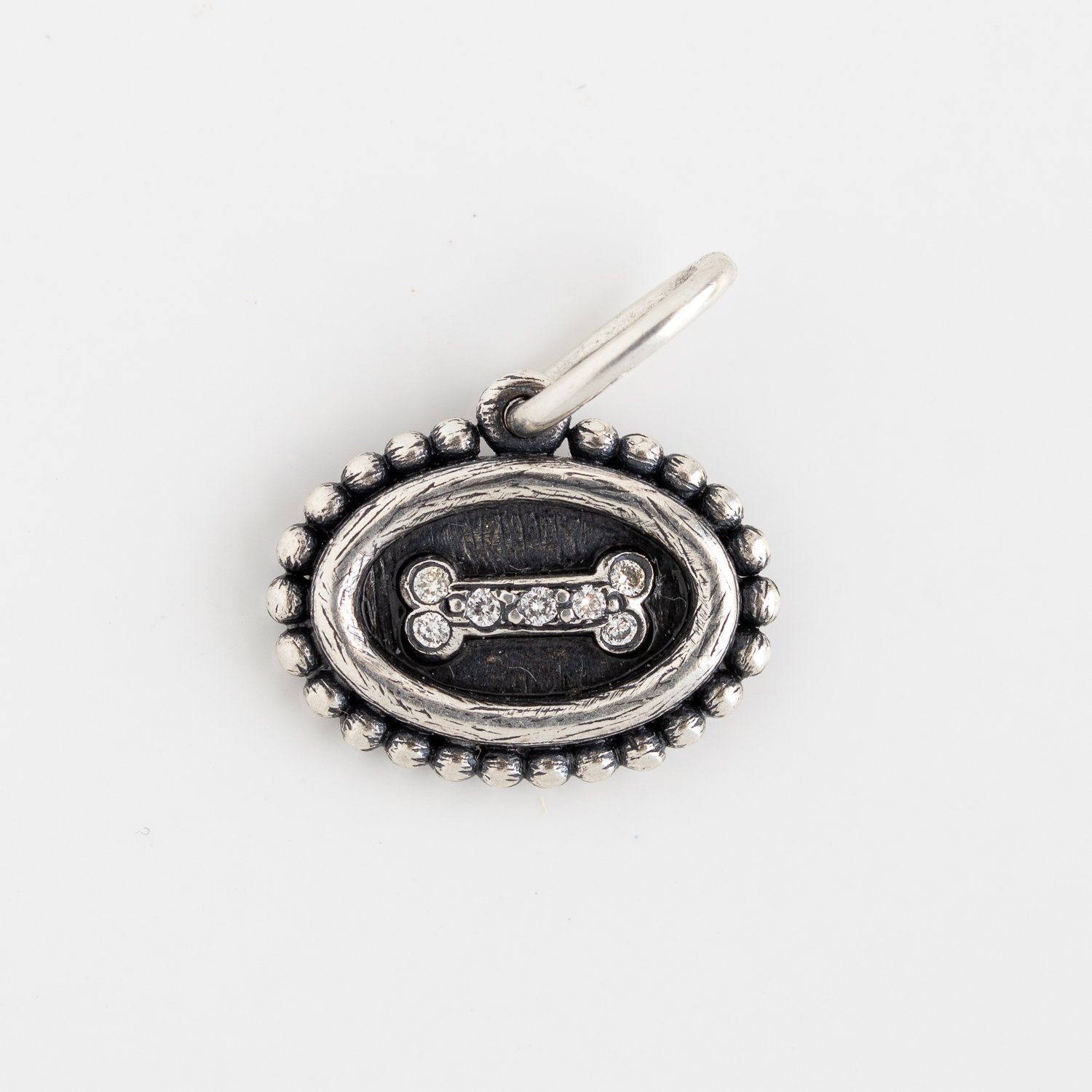 Erica Molinari Trunk Show: Charm, Small Oval Dogbone, Diamonds, .056 TCW, Sterling silver, Measures 3/4 x 5/8 including bail