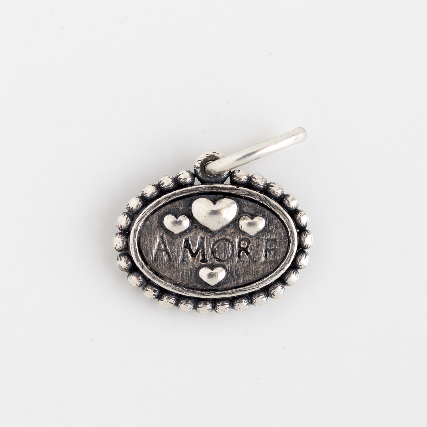 Erica Molinari Trunk Show: Charm, Small Oval Dogbone, Diamonds, .056 TCW, Sterling silver, Measures 3/4 x 5/8 including bail