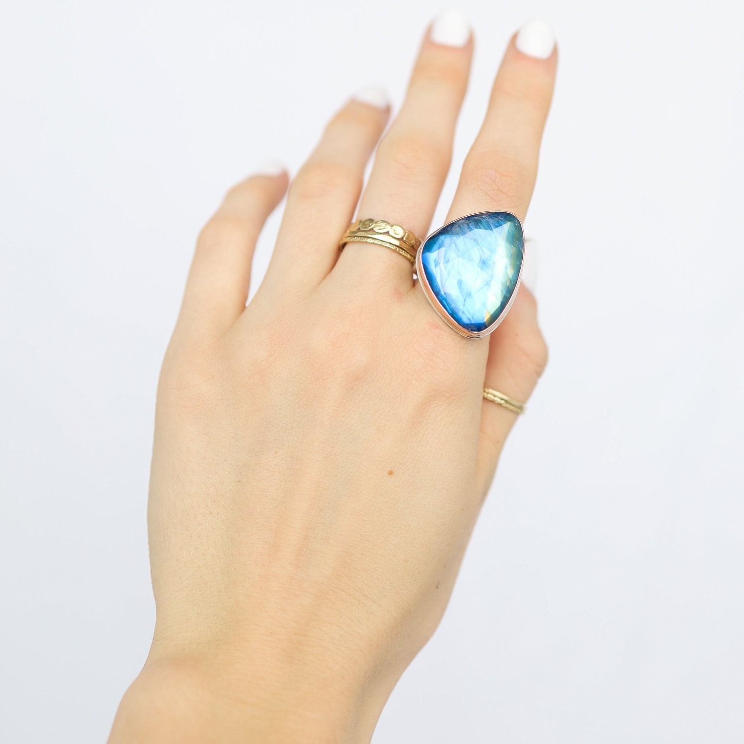 Jamie Joseph: Ring, Large vertical asymmetrical rose cut, 14K rose gold bezel set blue rainbow moonstone, Sterling silver Y band, Stone measures 1 1/16 x 13/16, Currently available in size 7 1/2