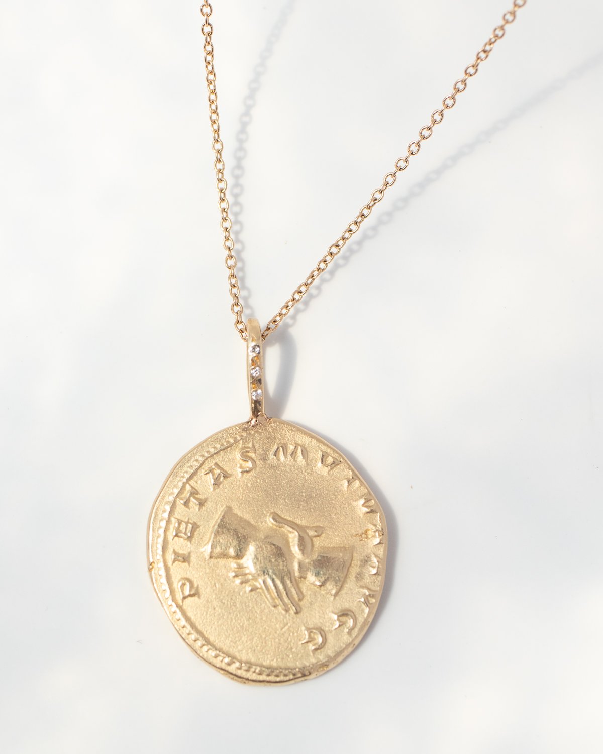 The Agreement Artifact Necklace in 14k yellow gold by jewelry designer Robin Haley