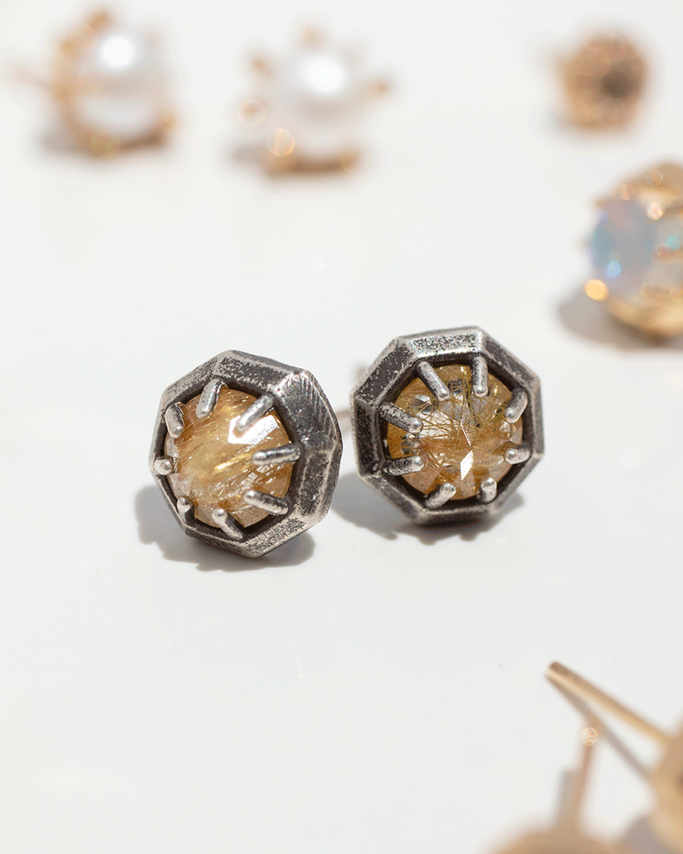 Semi-precious stone post earrings in 14k gold and oxidized sterling silver by jewelry designer Lauren Wolf