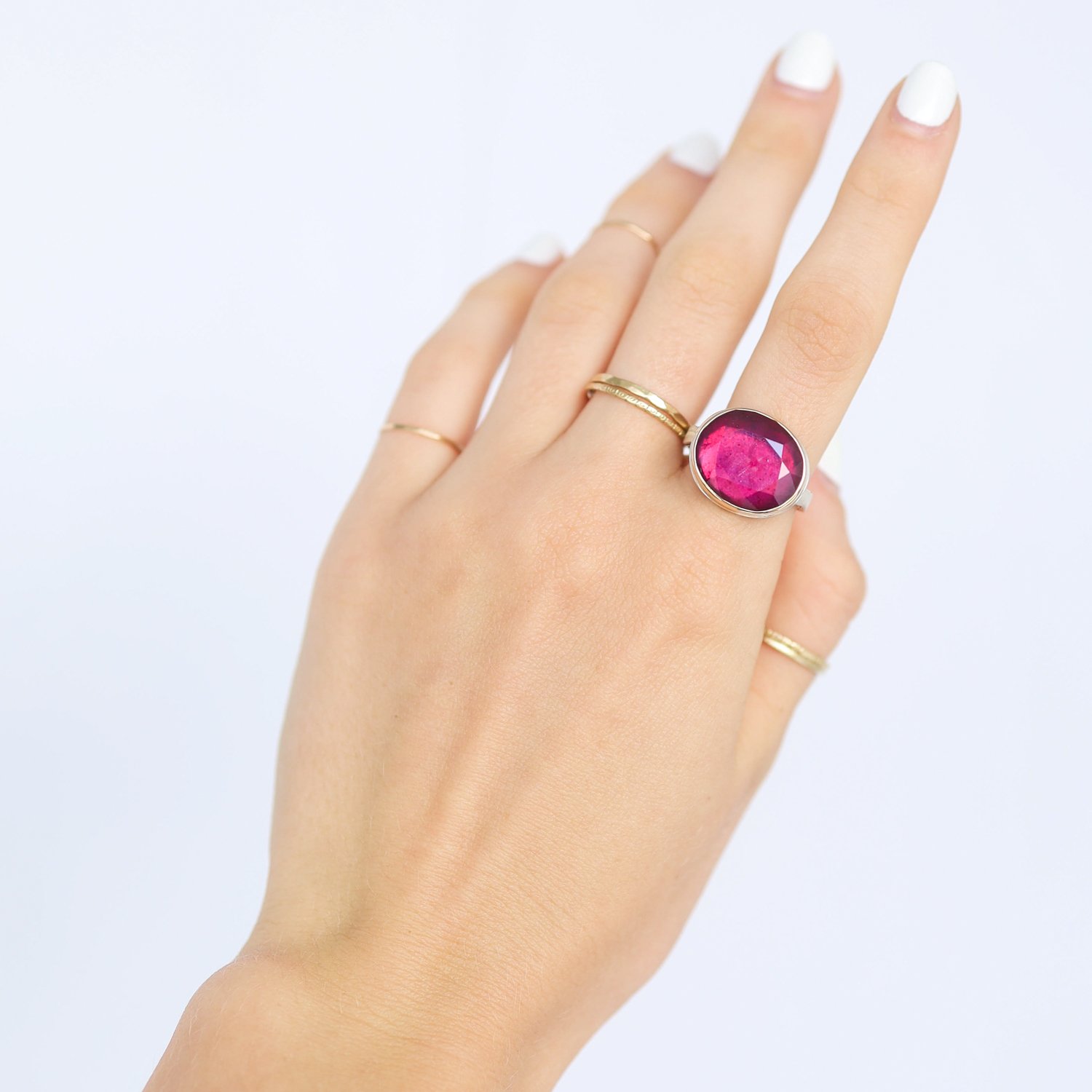 Jamie Joseph: Ring, Oval table up, 14K gold bezel set African ruby, Sterling silver eroded live edge band, Stone measures 9/16 x 5/8, Currently available in size 7 1/2