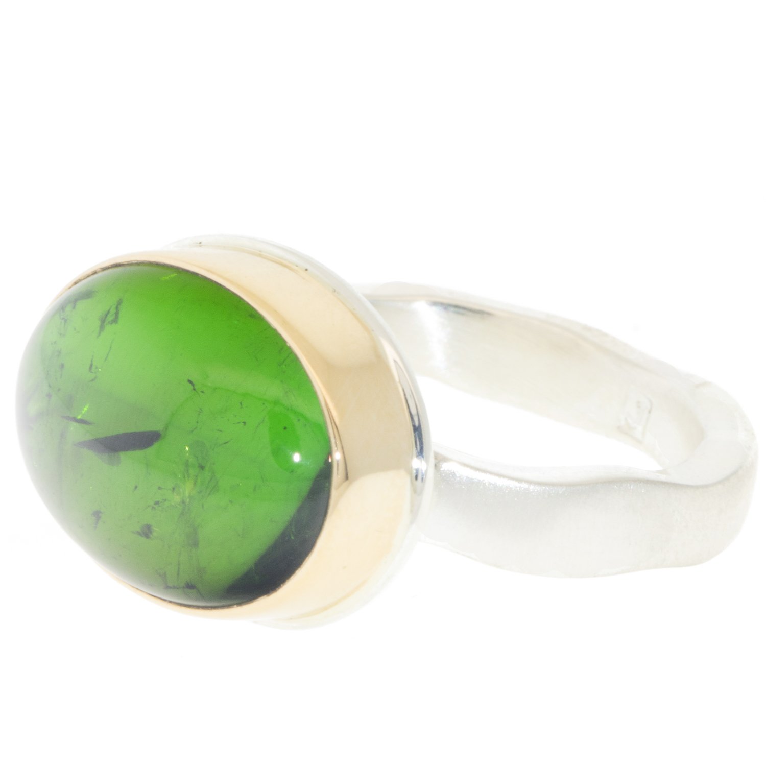 Jamie Joseph: Ring, Small oval smooth, 14K gold bezel set green tourmaline, Sterling silver soft live edge band, Stone measures 7/16 x 9/16, Currently available in size 7 1/4