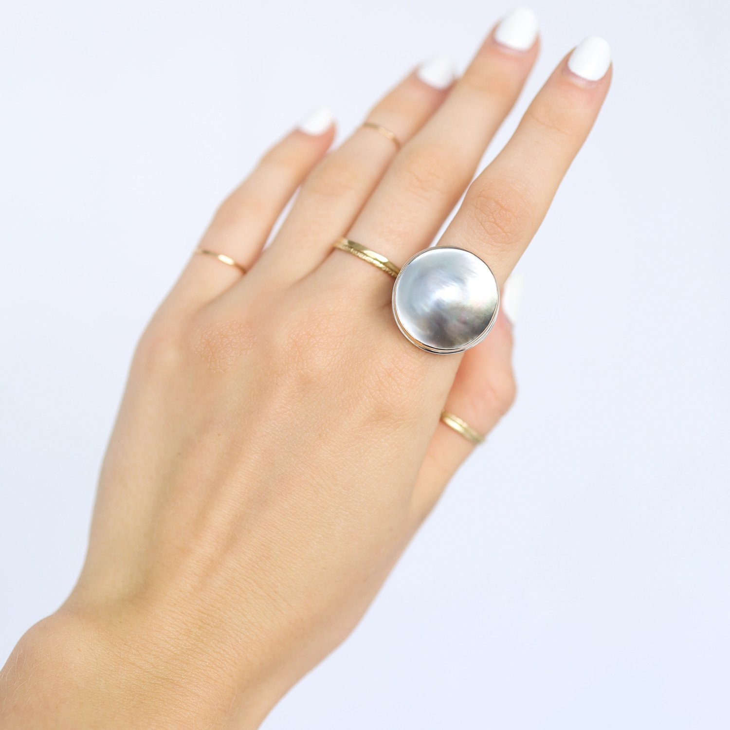 Jamie Joseph: Ring, Large round, 14K gold bezel set Tahitian mabe pearl, Sterling silver soft live edge band, Stone measures 13/16 in diameter, Currently available in size 7 1/2