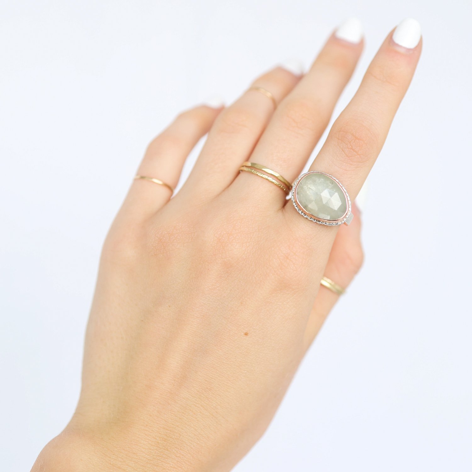 Jamie Joseph: Ring, Asymmetrical rose cut, 14K rose gold bezel set linen sapphire on lava platform, Sterling silver soft live edge band, Stone measures 1/2 x 5/8, Currently available in size 6 1/4