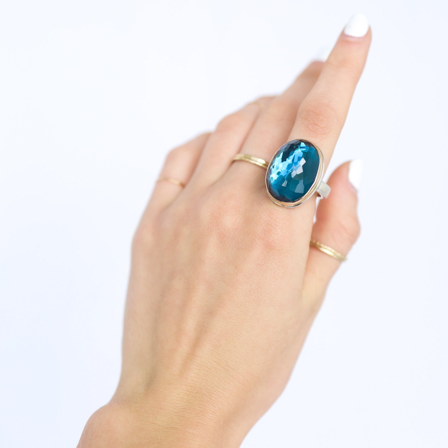 Jamie Joseph: Ring, Vertical inverted oval, 14K yellow gold bezel set London blue topaz, Sterling silver Y band, Stone measures 7/8 x 11/16, Currently available in size 8 1/4