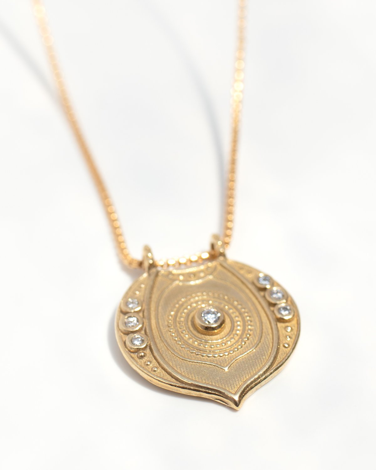 Aura necklace in bronze and 14k gold fill with white diamonds by jewelry designer Lulu Designs