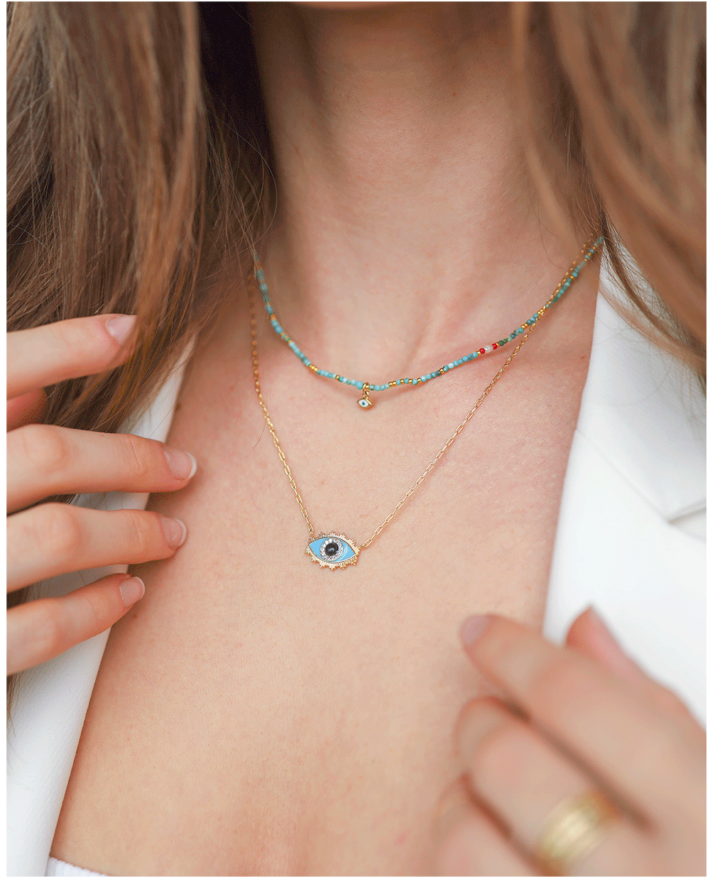 Gold necklaces by jewelry designer Tai