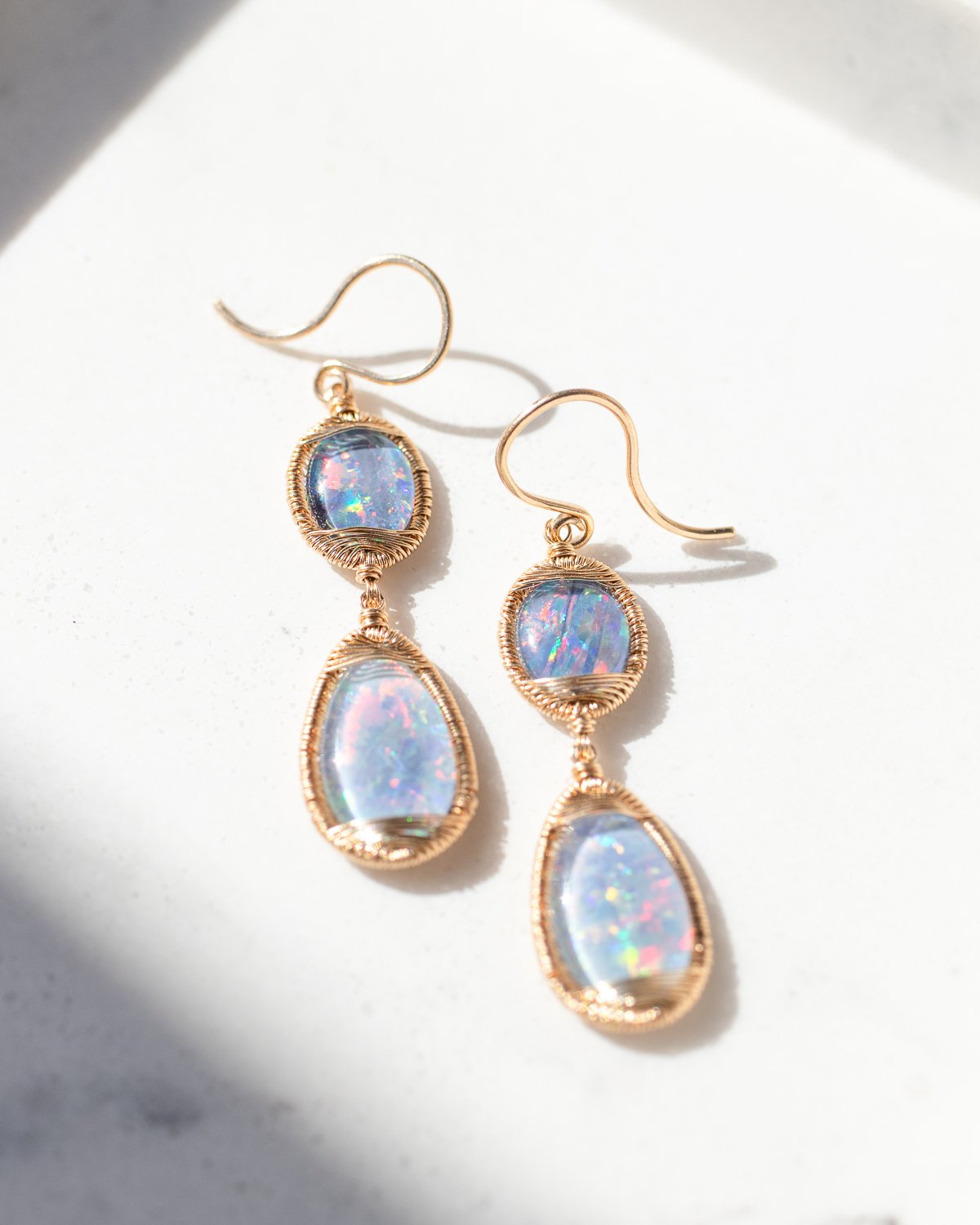 Gold wire wrapped opal earrings by fine jewelry designer Dana Kellin