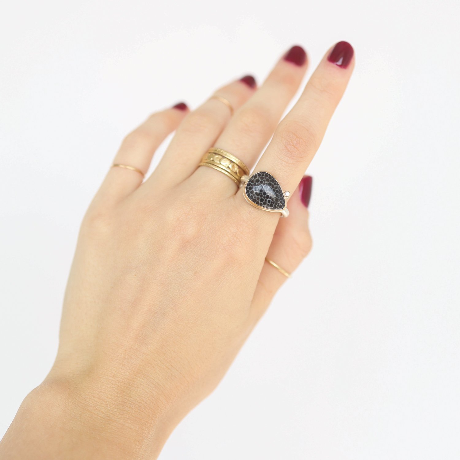 Jamie Joseph: Ring, Teardrop, 14K gold bezel set fossilized stingray coral, Satellite diamond, .025ct, Sterling silver Egyptian band, Stone measures 7/16 x 5/8, Currently available in size 7