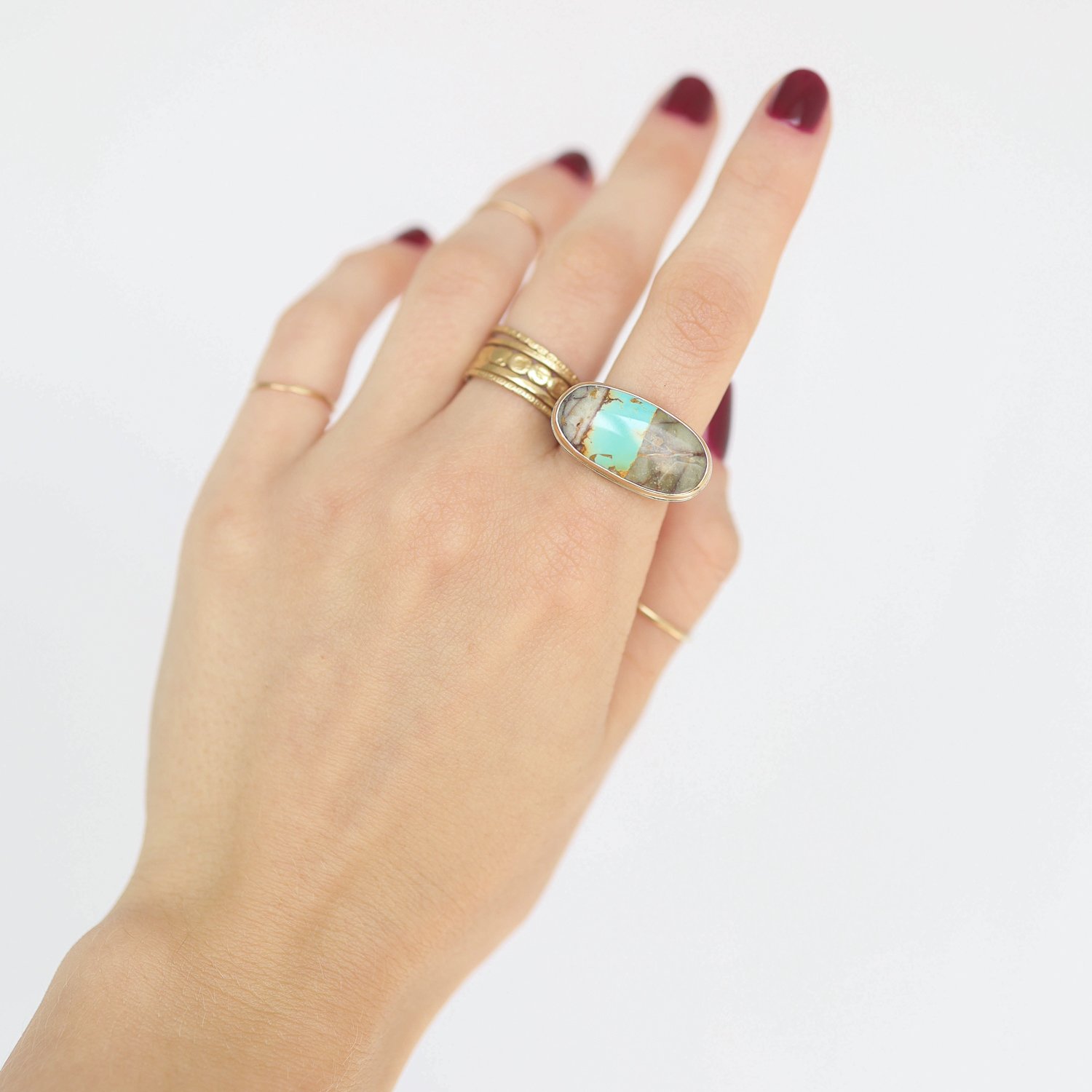 Jamie Joseph: Ring, Oval, 14K gold bezel set Royston turquoise, Sterling silver middle organic band, Stone measures 7/16 x 7/8, Currently available in size 6 3/4