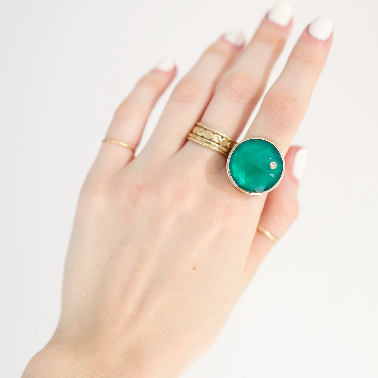 Jamie Joseph: Ring, Round rose cut, 14K gold bezel set green onyx, Diamond .03ct, Sterling silver live edge band, Stone measures 3/4 in diameter, Currently available in size 7 1/2