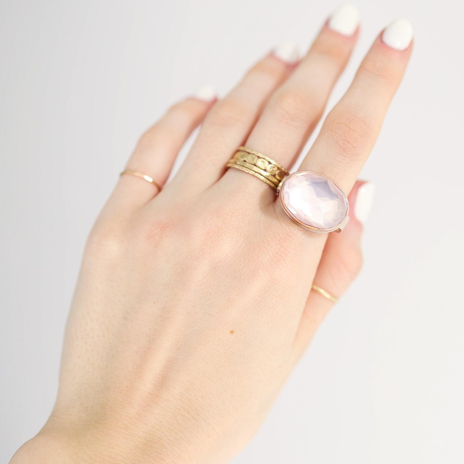 Jamie Joseph: Ring, Oval rose cut, 14K rose gold bezel set rose quartz, Sterling silver live edge band, Stone measures 9/16 x 3/4, Currently available in size 7 1/4