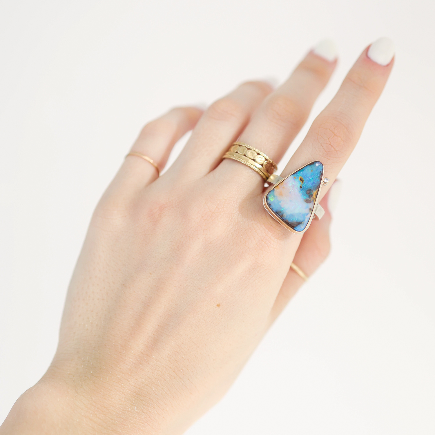 Jamie Joseph: Ring, Vertical triangle, 14K gold bezel set Boulder opal, Diamond, .25ct, Sterling silver X band, Stone measures 7/8 x 5/8, Currently available in size 7 1/4