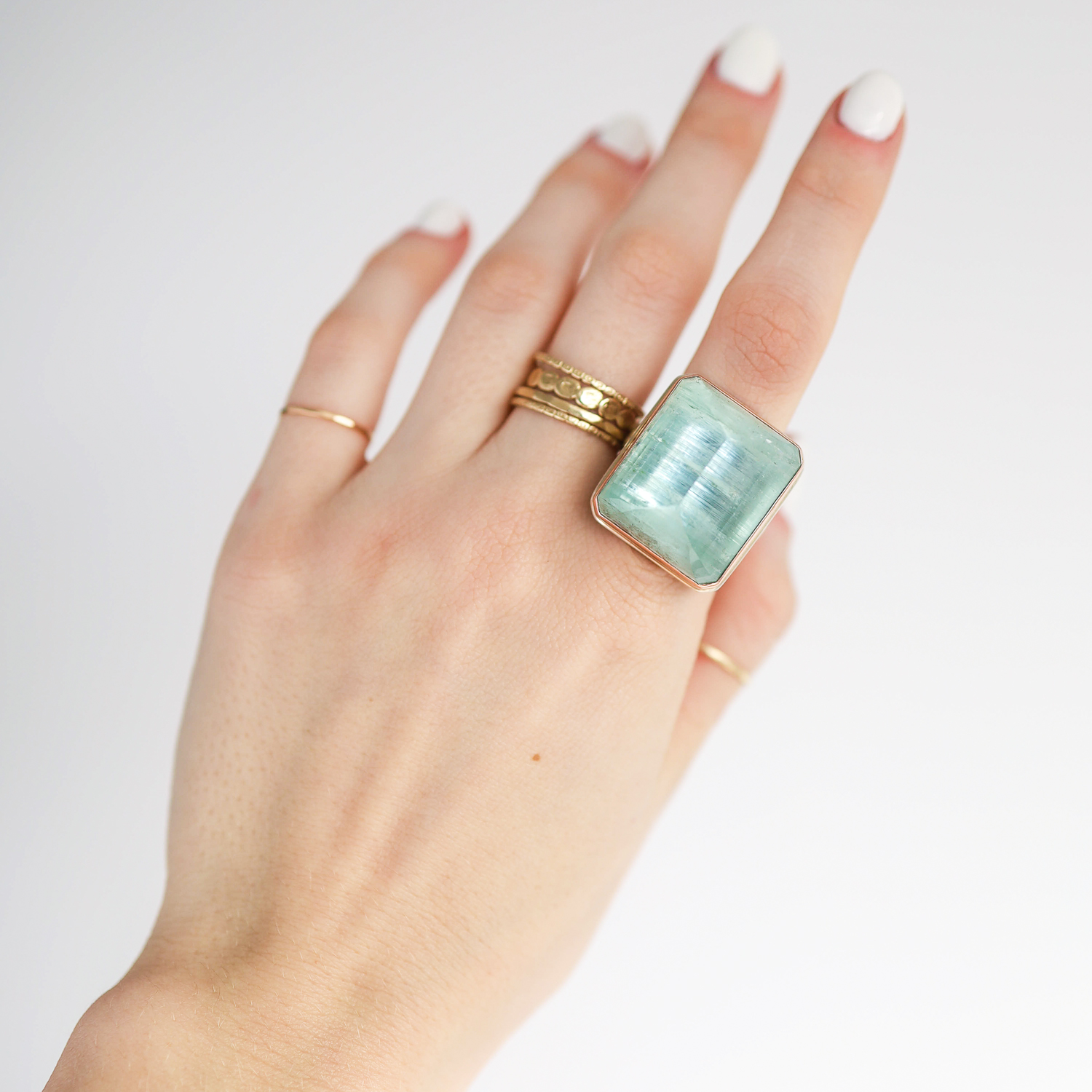 Jamie Joseph: Ring, Large vertical rectangular inverted, 14K gold bezel set green beryl, Sterling silver Y band, Stone measures 15/16 x 13/16, Currently available in size 8 1/4