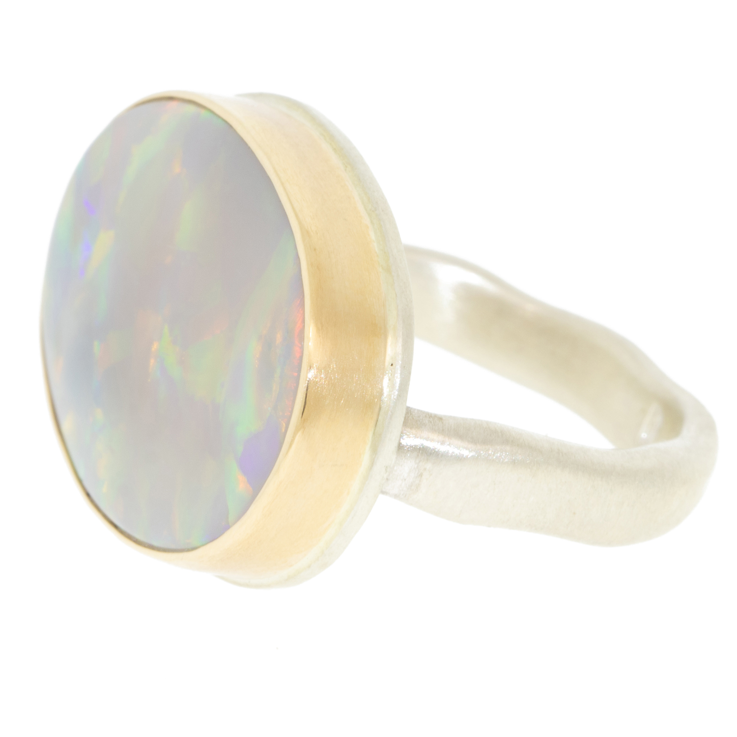 Jamie Joseph: Ring, Oval, 14K gold bezel set Australian black opal on open back platform, Sterling silver middle groovy band, Stone measures 5/8 x 7/8, Currently available in size 7 1/2
