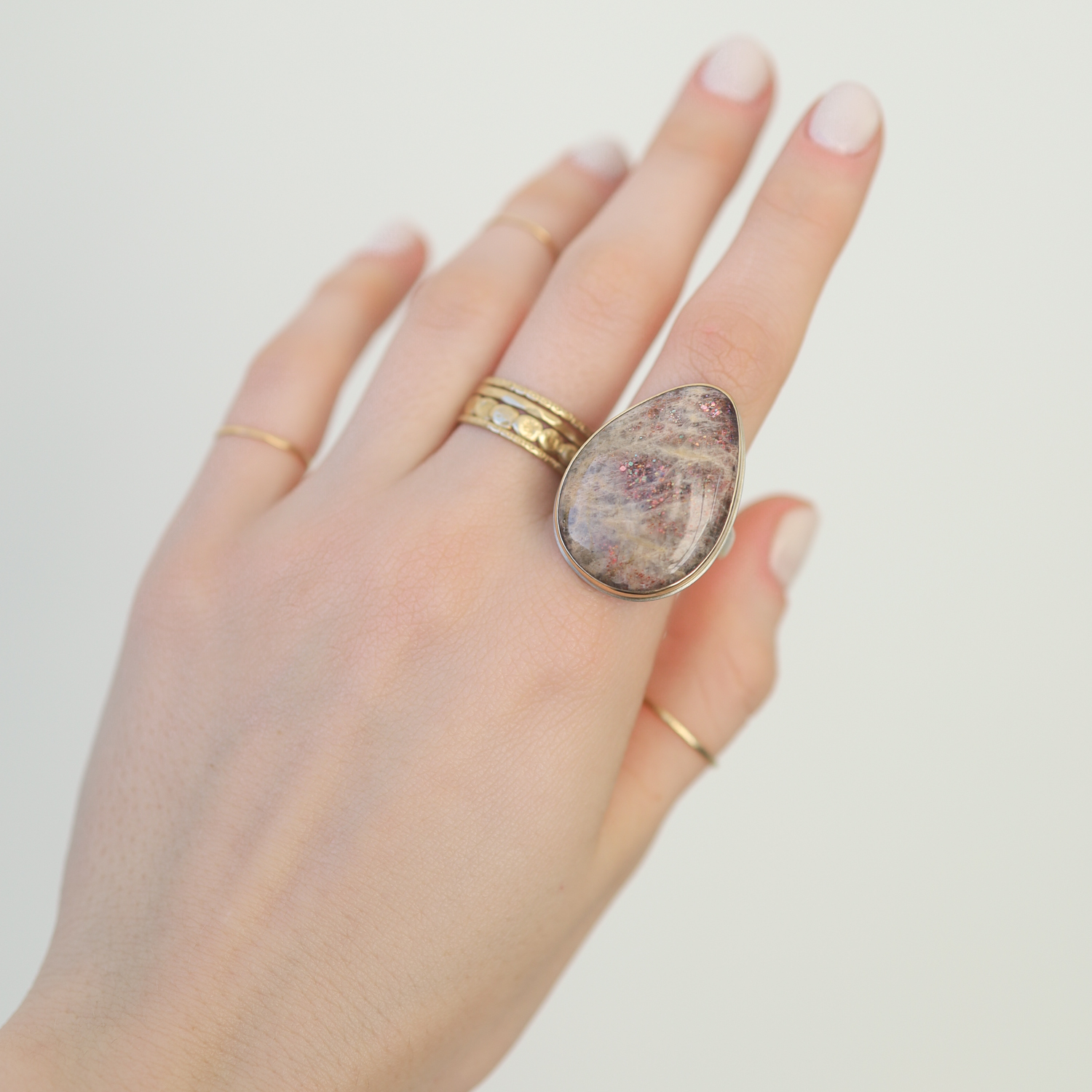 Jamie Joseph: SS and 14K gold ring with vertical Teardrop smooth Rainbow Lattice Sunstone,Groovy band, size 8.5, Measures 1 1/8 x 13/16