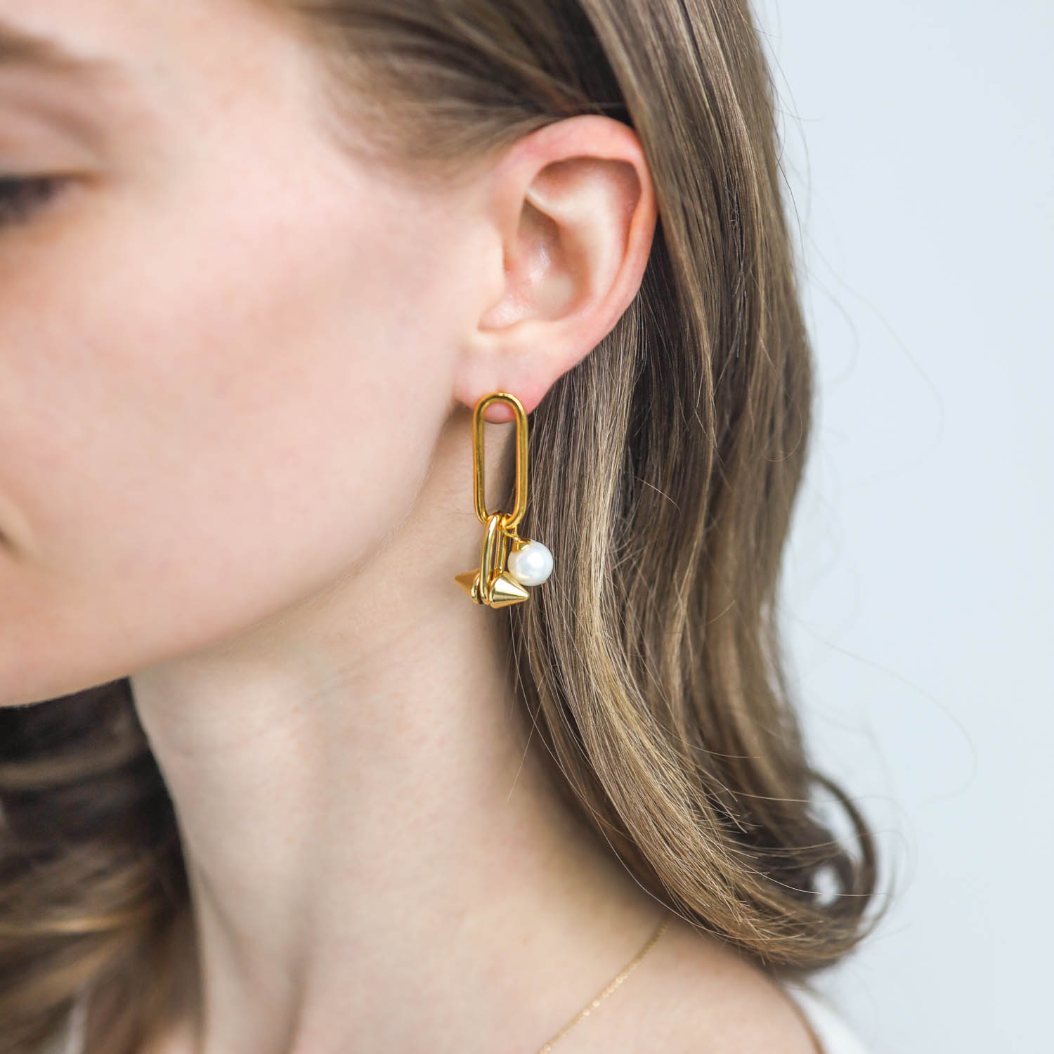Catherine Canino:Punk pearl earring with pearl drop,14k gold over brass
