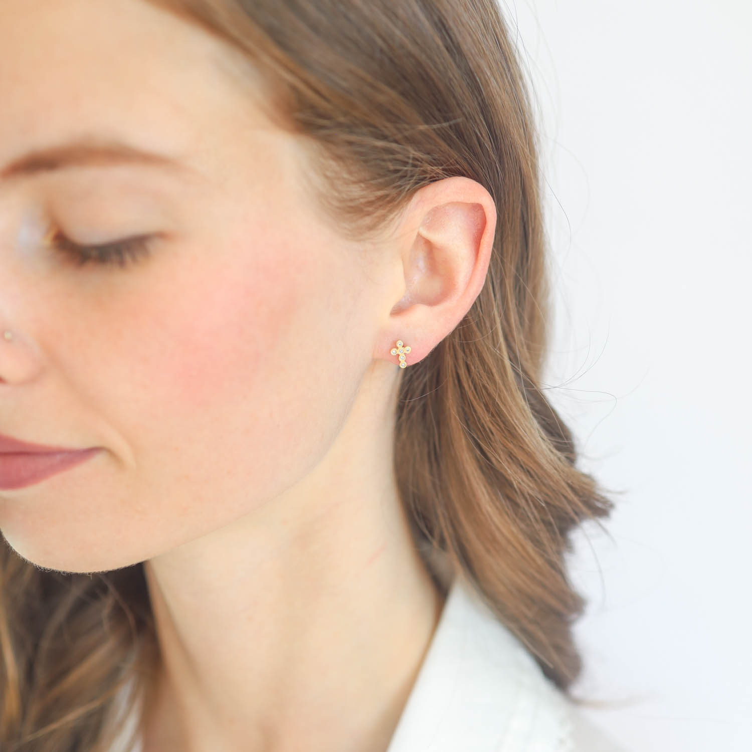 Victoria Cunningham Trunk Show: Earrings, Studs, cross posts w/diamond 14K gold. 5/16" x 1/4"