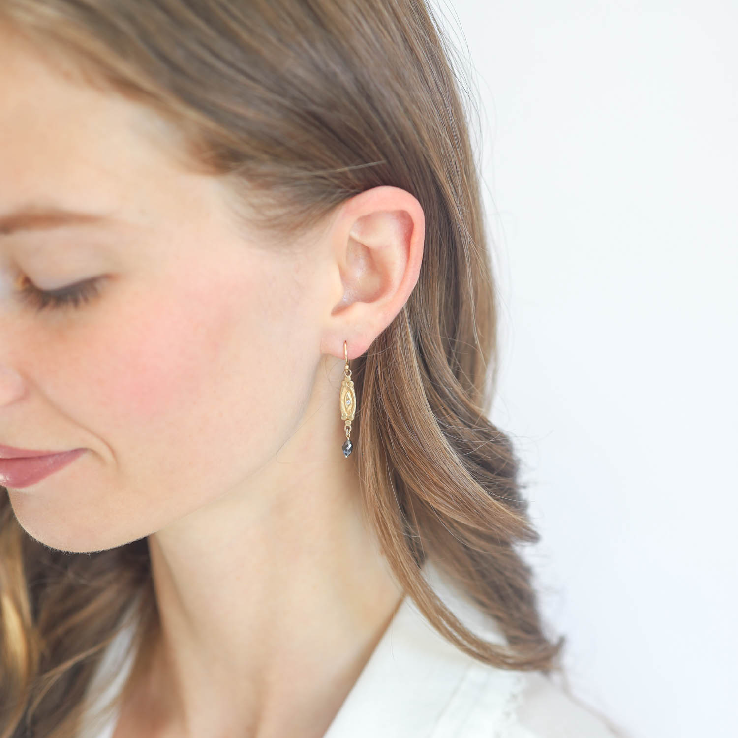 Victoria Cunningham Trunk Show: Earrings, eye w/black diamond bead drop 14K Yellow Gold. 1 3/8" x 3/16" including earwire