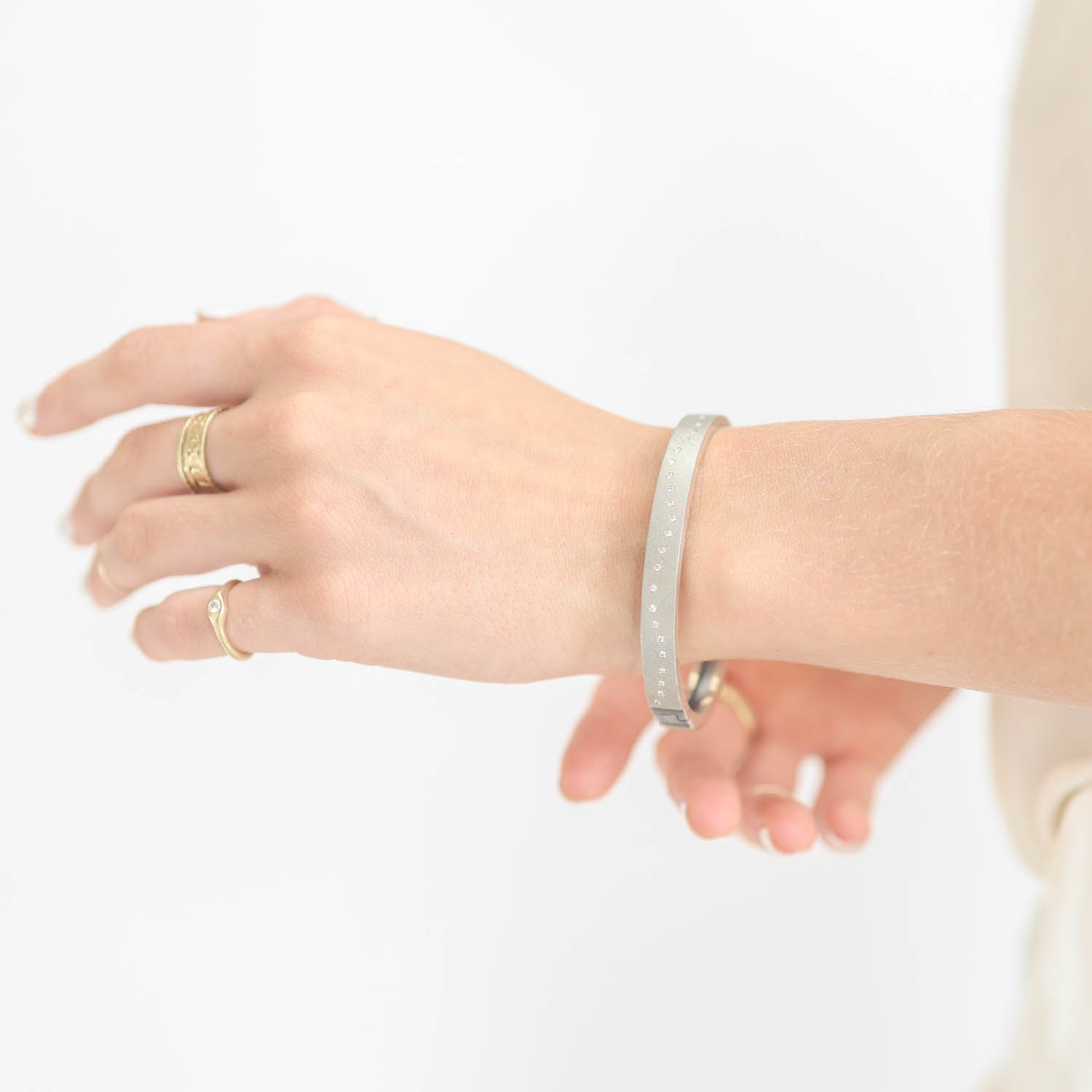 Rene Escobar: Bracelet, Bangle, RENE, 18K White Gold Top and back,0.50ct diamonds, 6 MM,Size Medium