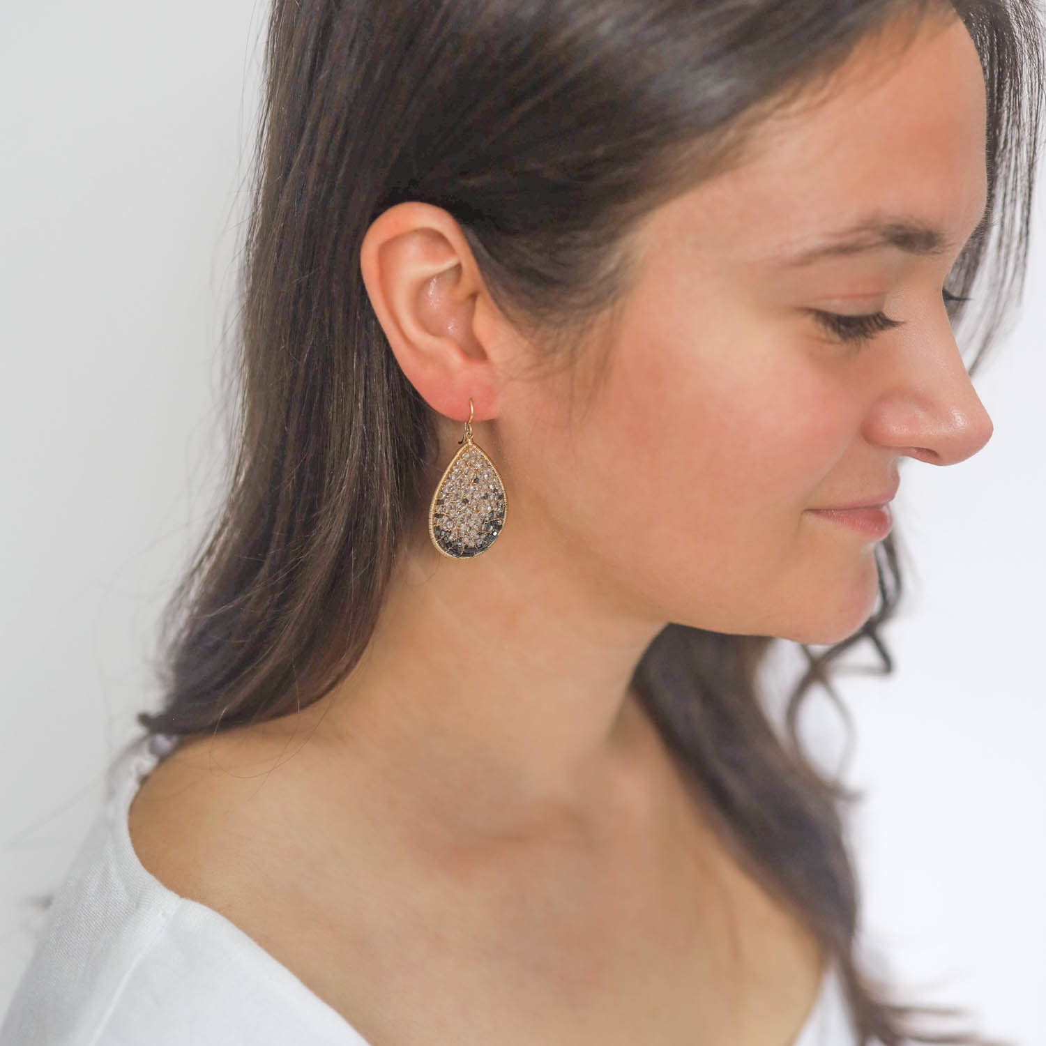 Dana Kellin: Earrings,rounded Teardrop,Clear crystals and Hematite ,Gold Fill, measure 1 3/4" x 7/8" including earwire