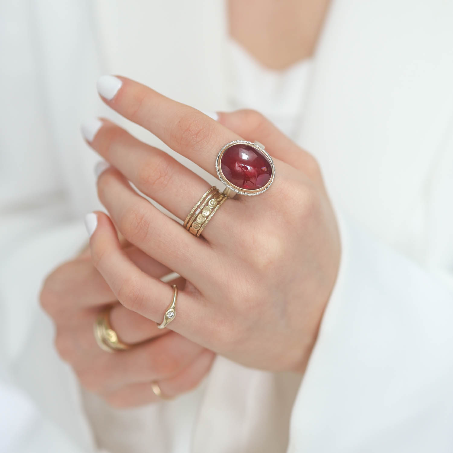Jamie Joseph: AFRICAN RUBY SS and 14k Gold Ring on lava platform on Y band, measures 3/4" x 9/16" size 7
