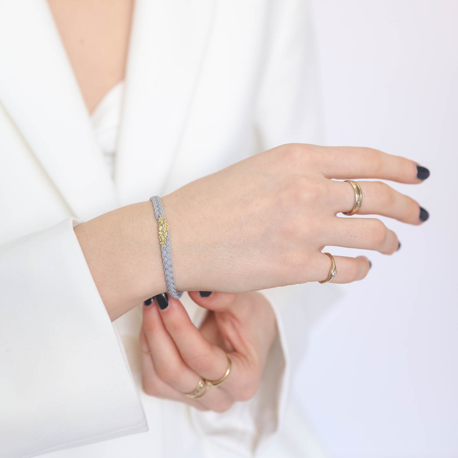 Lene Vibe: Bracelet,18k gold with flowers,0.01CT White diamonds,cultured pearls,Light Grey Nylon cord. Flower measures 1/4" x 11/16" , 7.5" in length