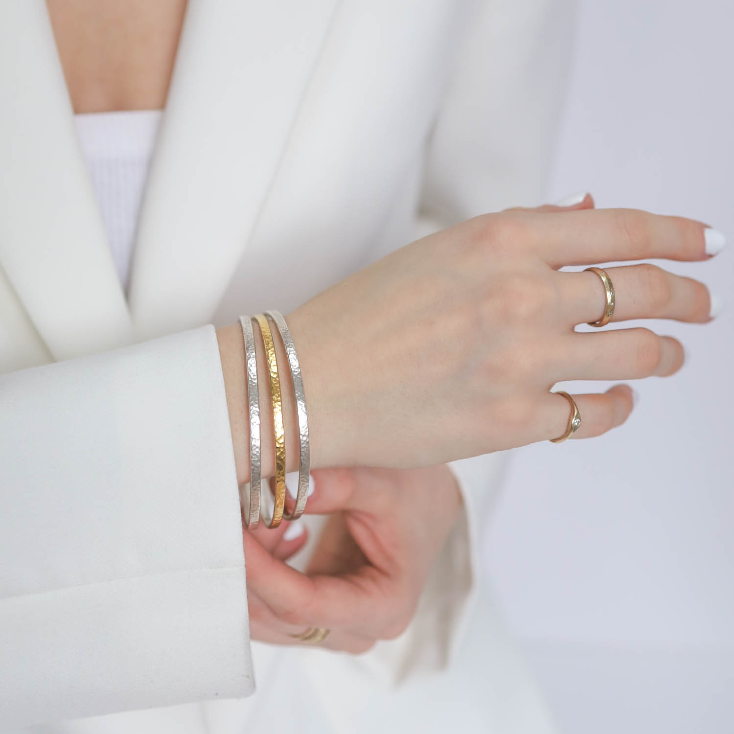 Gurhan: Bracelet, Mango bangle,set of 3,2 sterling silver & 1 silver layered with 24k Gold, measure 1/8" in width