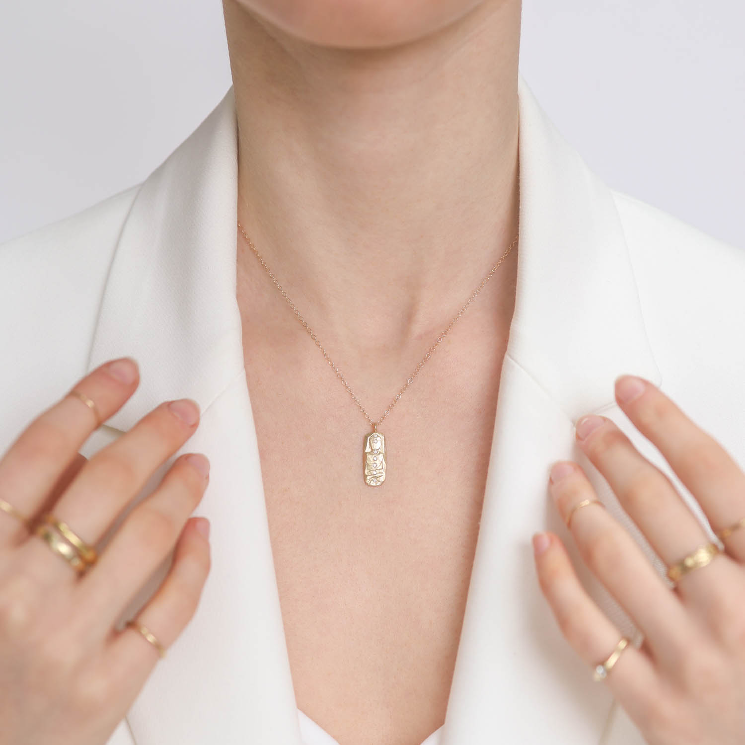 Victoria Cunningham: Necklace, 14k Diamond Chakra Buddha Tab, Pendant measures 7/8" x 5/16" including bail, Chain measures 16 1/2"