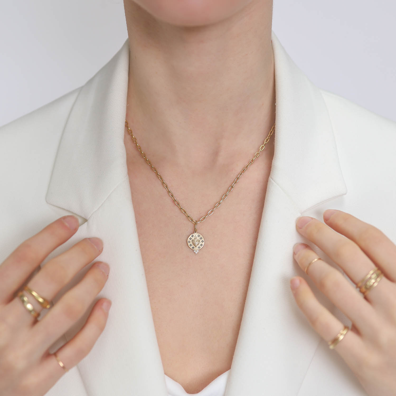 Erica Molinari Trunk Show: 14k Small round sacred heart,'Forget me Not' 0.0075cts