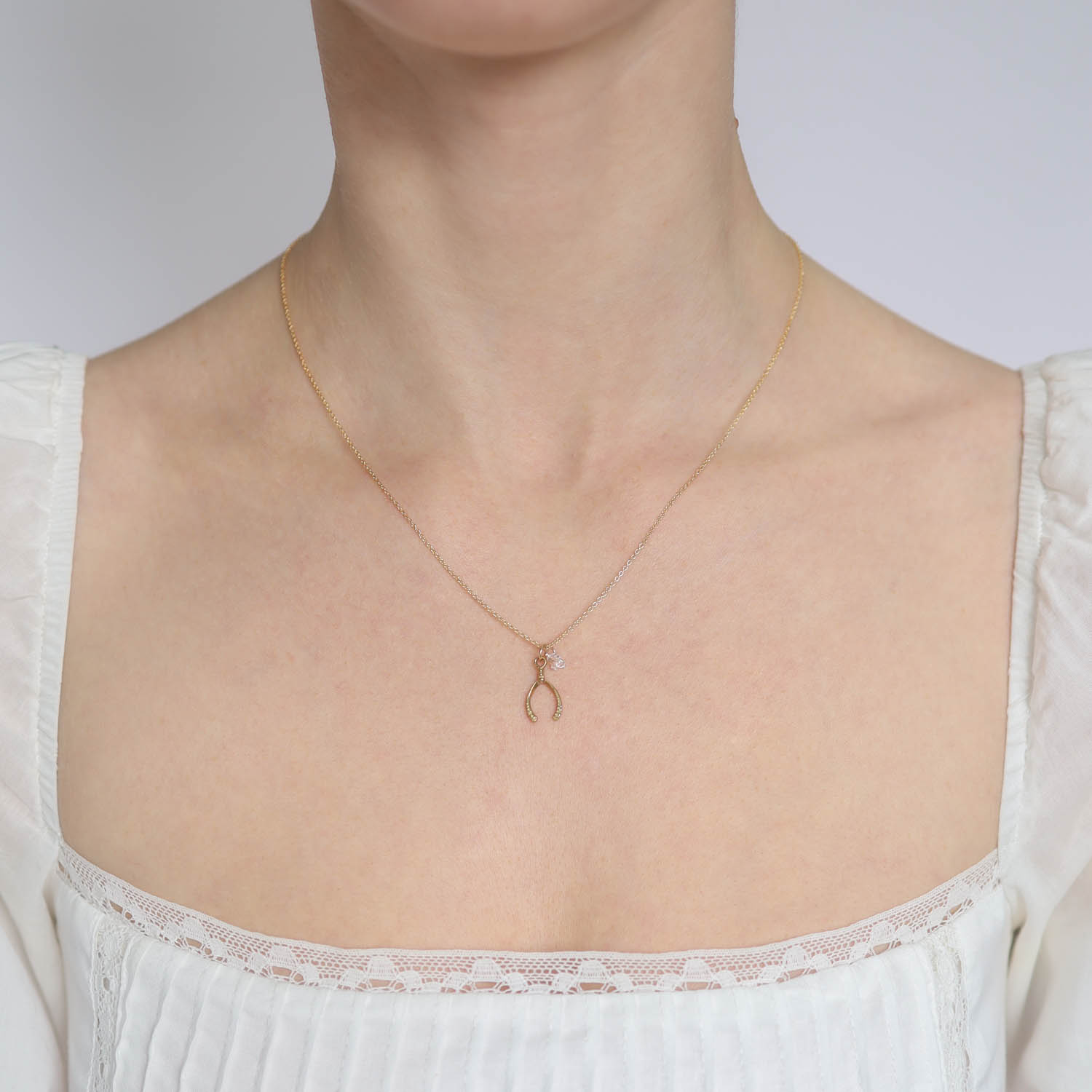 LuLu: Bobby Necklace mini "stay in the magic" yellow bronze, gold fill, Adjustable chain measures 16" and 18", wishbone measures 3/4" x 5/16" including bail