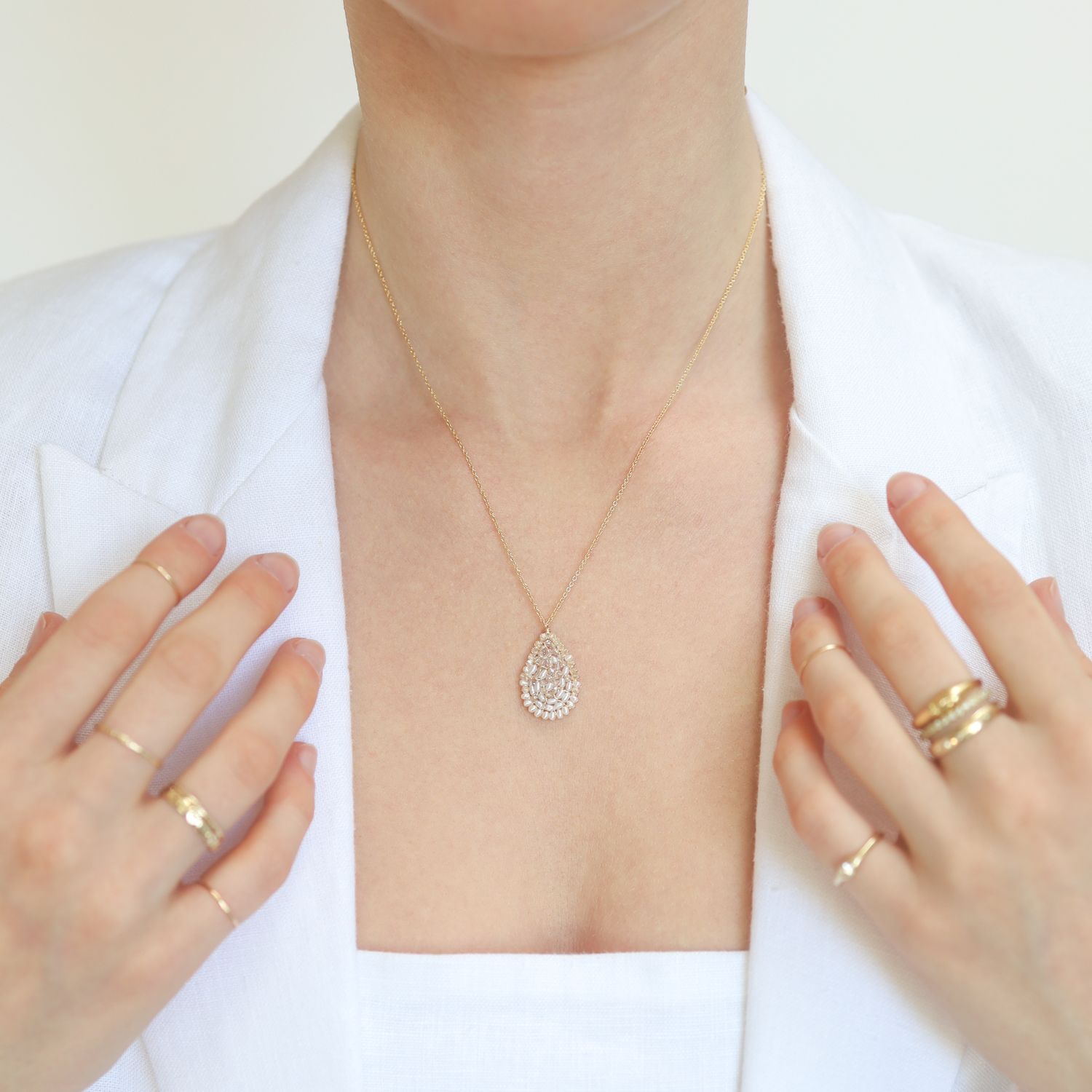 Dana Kellin: Necklace,14K Gold filled ,teardrop shaped Clear crystal pendant,PEARL RIM, Pendant measures 1" x 5/8" including bail, 18"