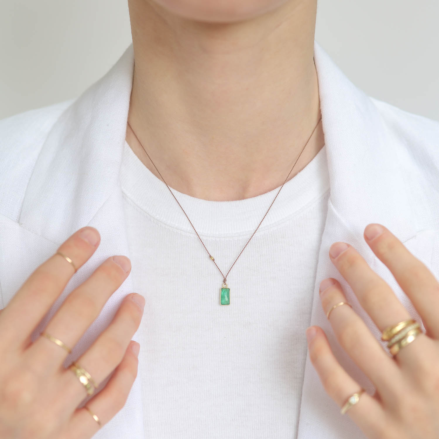 Margaret Solow: Emerald Necklace, 18k Gold, Nylon cord measures 17" in length