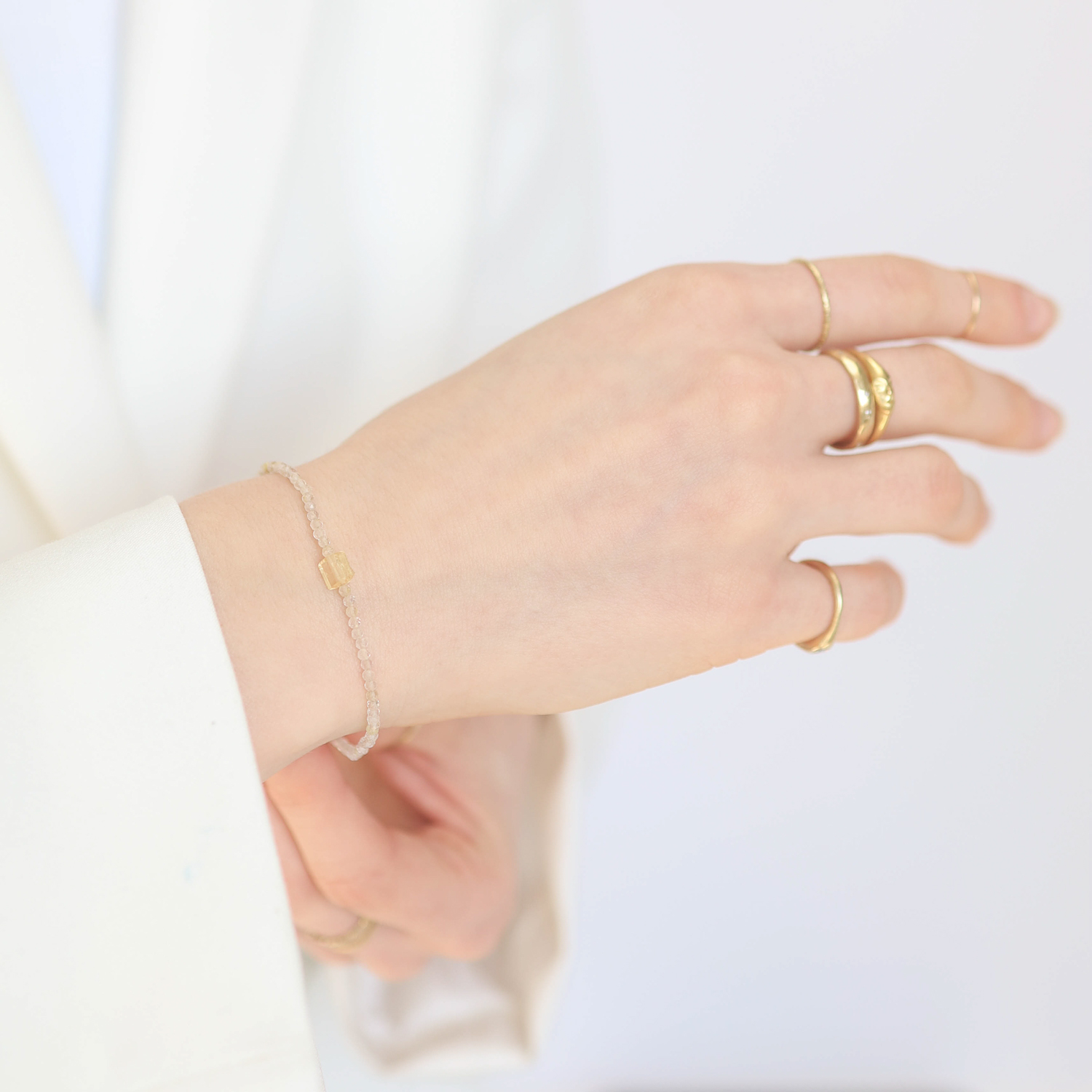 Margaret Solow : Beaded bracelet,18k Rutilated quartz and imperial topaz