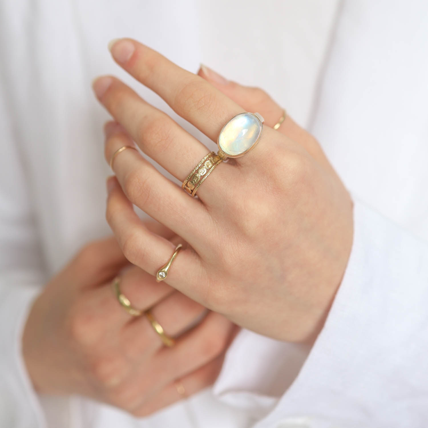 Jamie Joseph: WHITE RAINBOW MOONSTONE SS & 14k gold w/ oval smooth on Y band size 7, 7/16" x 11/16"