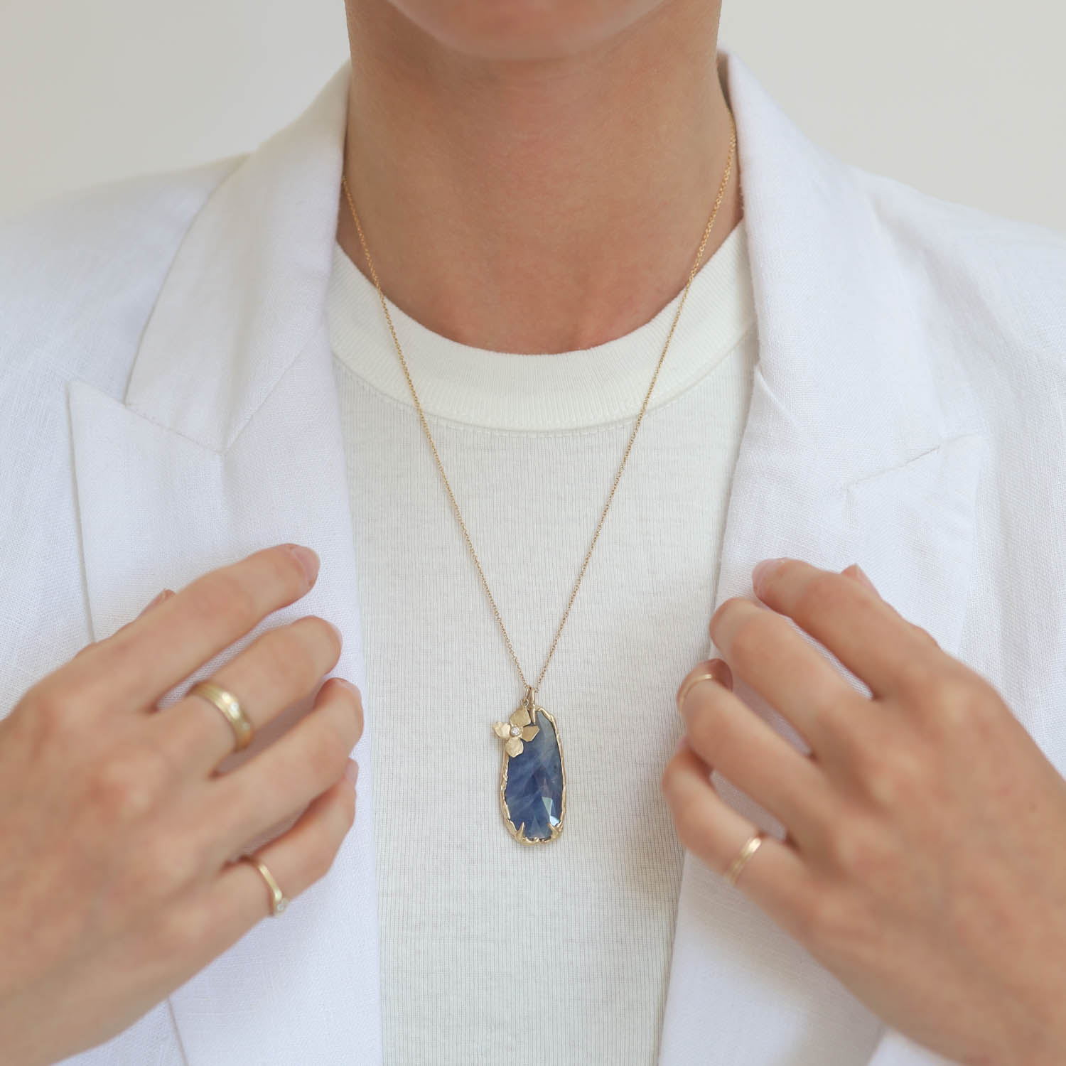 Victoria Cunningham Trunk Show: Necklace,17ct Sapphire and hanging flower, 1 5/8" x 5/8" including bail, 20"