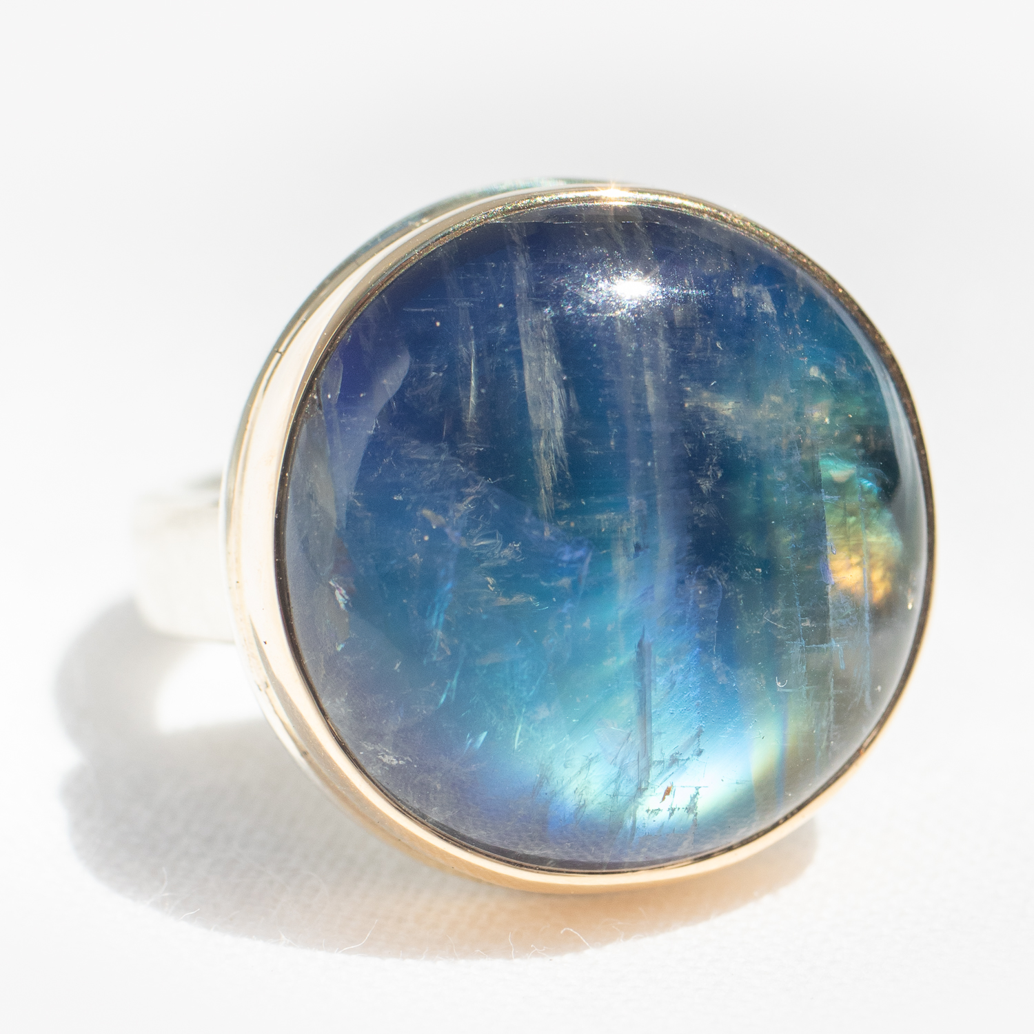 Gold and silver ring with moonstone by jewelry designer Jamie Joseph